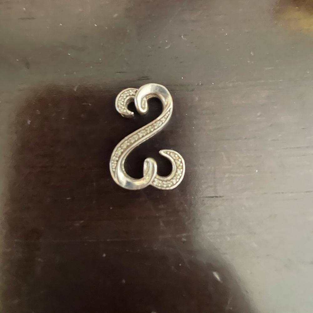 Open heart charm with diamonds